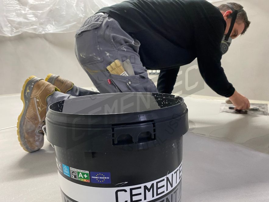 cementec product application work by an applicator explaining the difference between microcement and polished cement.
