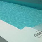 Close-up of white microcement swimming pool, with stairs covered with Cementec Pool microcement.