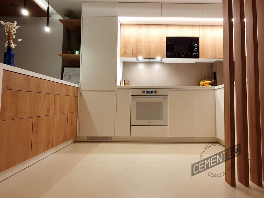 Example of a white microcement kitchen made and clad by Cementec.