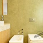 Bathroom with texture of microcement wall finishes.