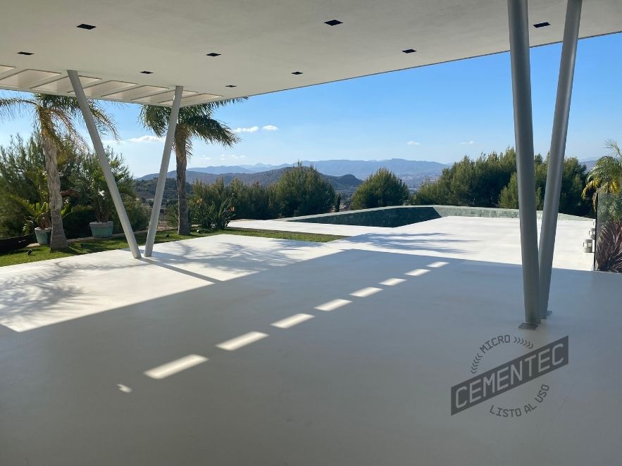 Terrace or outdoor living area clad with non-slip exterior microcement.