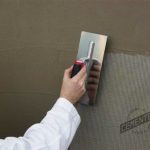 Applicator using a glass fibre mesh for microcement.