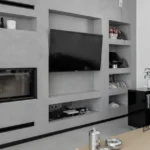 Sala de estar acabada en microcemento listo al uso color gris de Cementec.